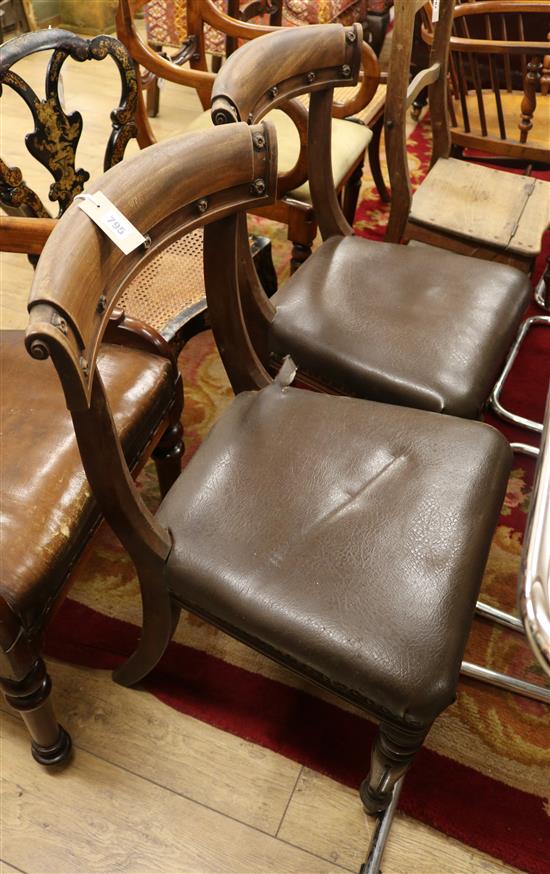 A pair of early Victorian mahogany leather upholstered dining chairs